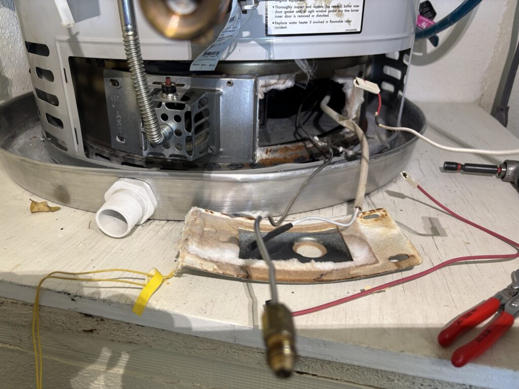 Water heater components being professionally diagnosed and repaired