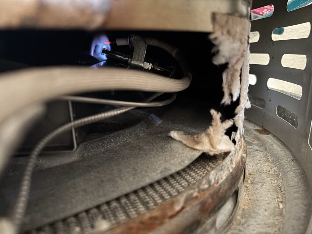 Close-up inspection of a water heater burner assembly
