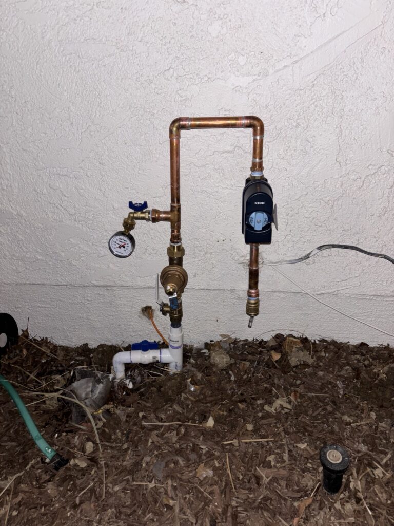 Moen Flo water monitor and automatic shutoff installed on a water line
