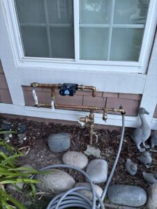 Moen Flo smart water monitor, pressure-reducing valve, and copper bypass piping at a Simi Valley home