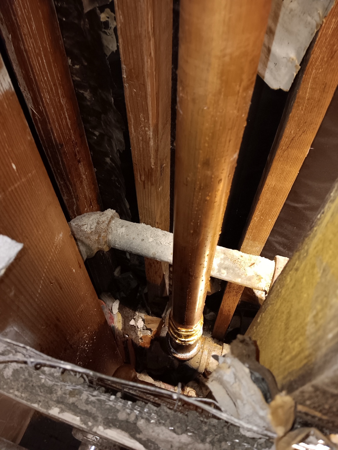 Close-up of brass and copper connection in the water supply repair